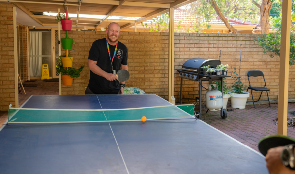 man playing ping pong