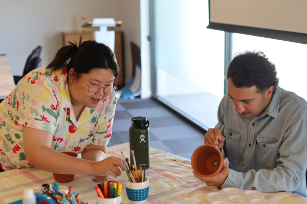 Two people painting