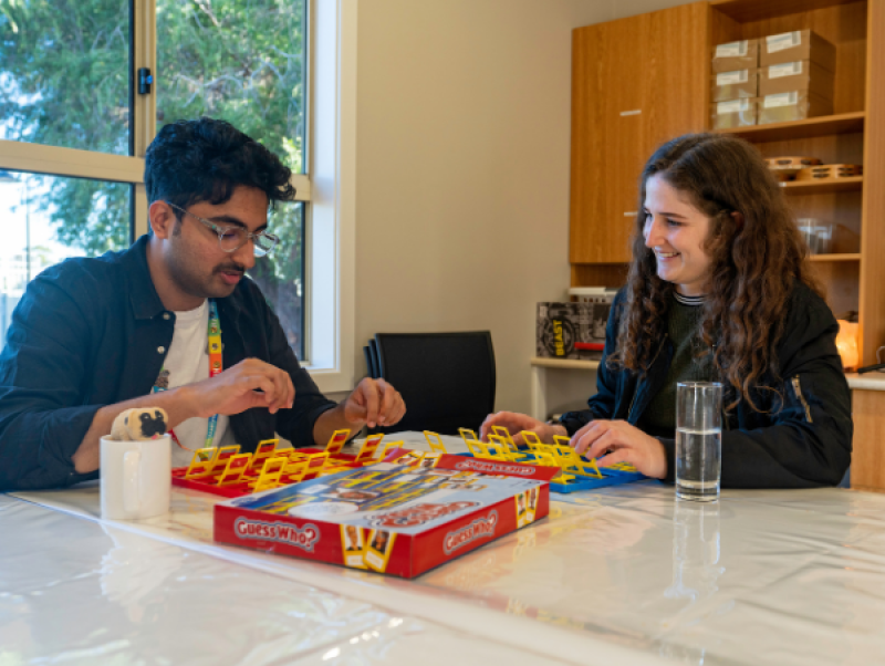 two people playing a board game
